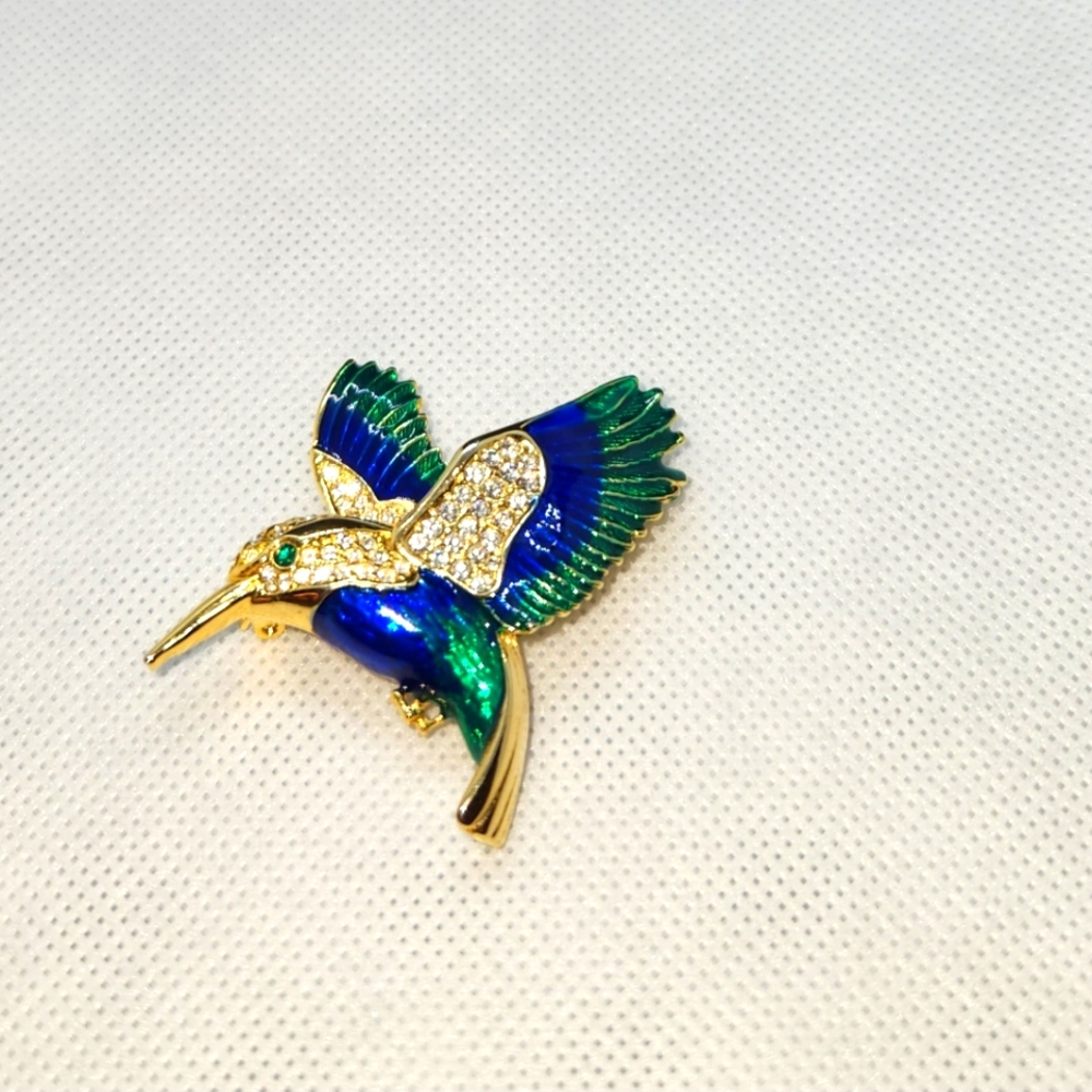 Gold tone hummingbird brooch